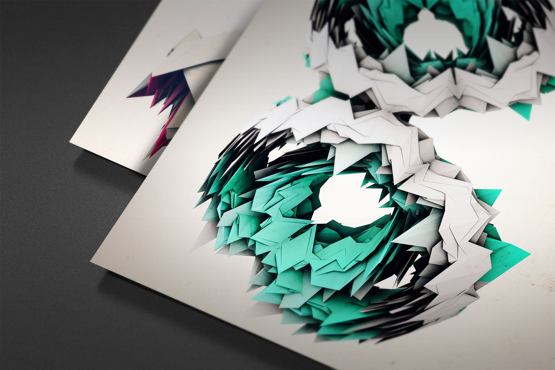 Two Metaphorm 3D artwork posters on a dark surface overlapping each other